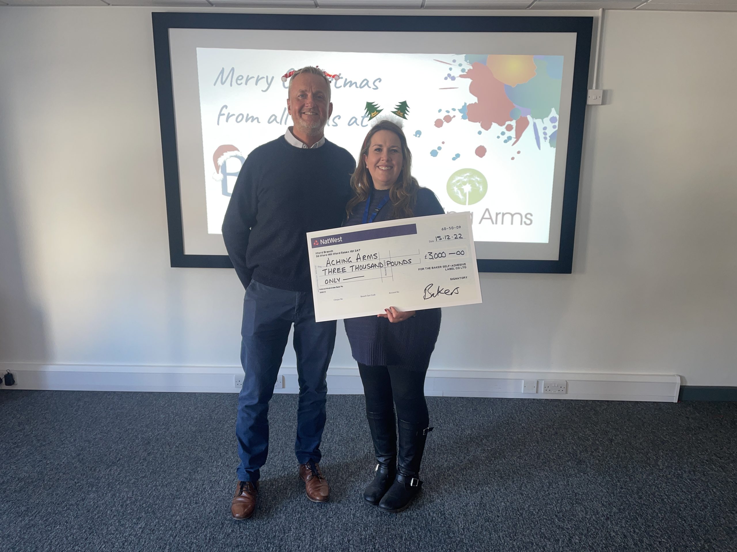 Aching arms charity receive a donation from bakers