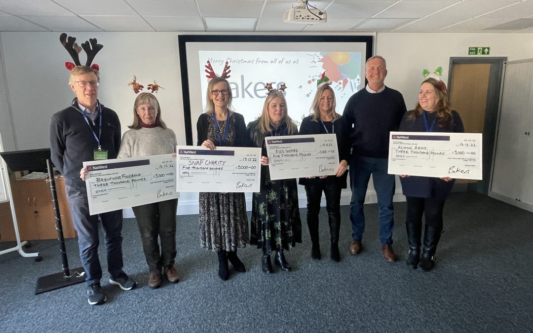 Charity donations presented large cheques by Steve Baker