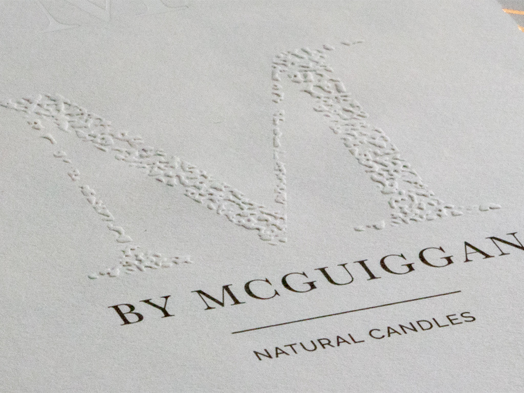 Close-up of a luxury label with an embossed logo